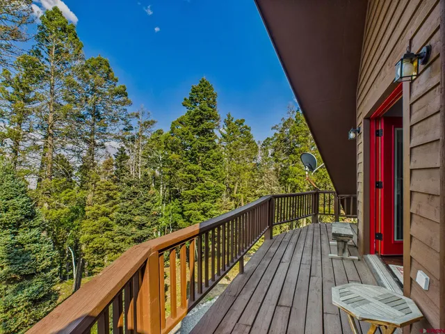 a view of balcony with furniture
