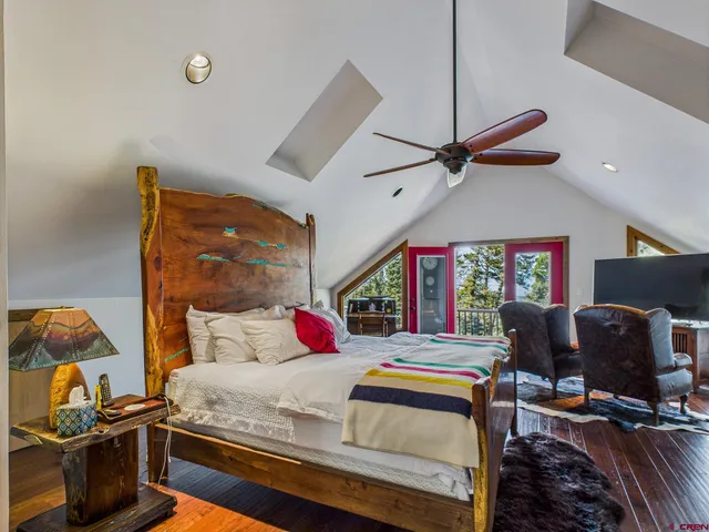 a bathroom with a toilet a sink and shower
