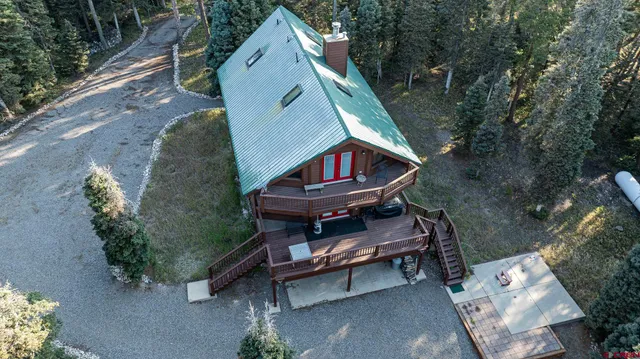 a backyard of a house with outdoor seating