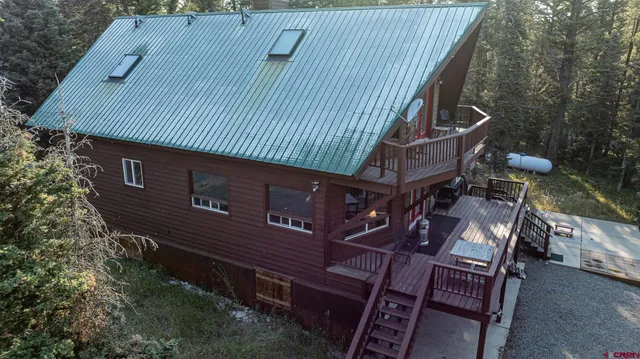 a view of a backyard with sitting area