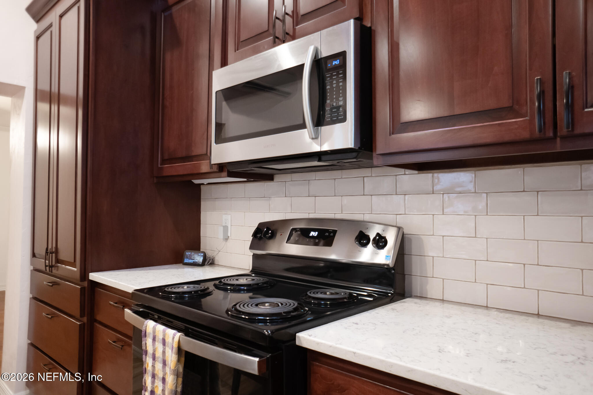 161 Southwest Jasmine Avenue Keystone Heights, FL 32656 - Photo 15 of 47 a kitchen with a stove and microwave