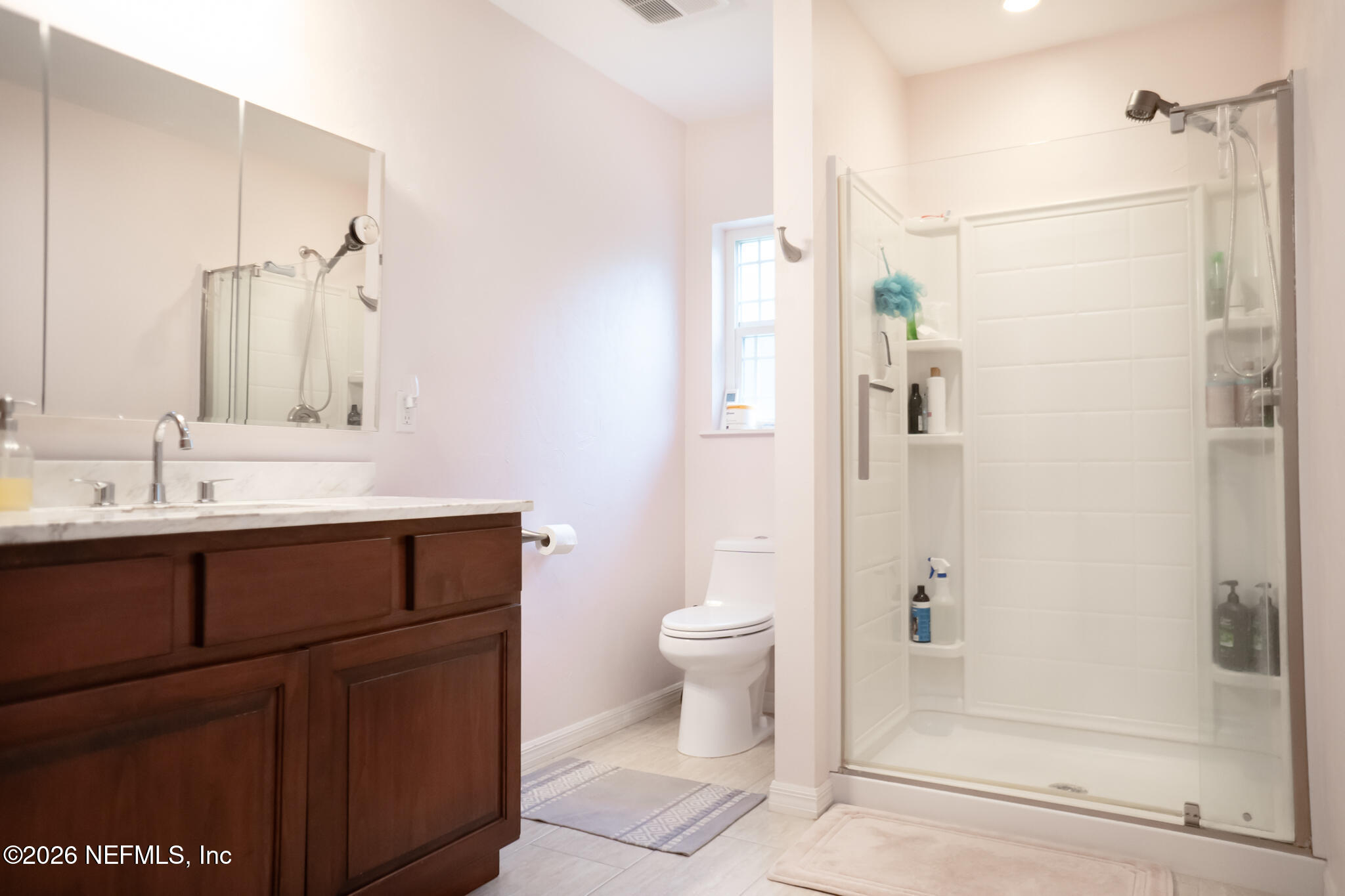 161 Southwest Jasmine Avenue Keystone Heights, FL 32656 - Photo 19 of 47 a bathroom with a sink a toilet and shower