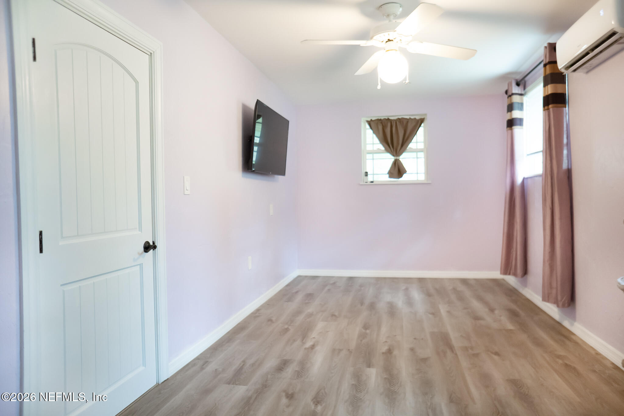 161 Southwest Jasmine Avenue Keystone Heights, FL 32656 - Photo 31 of 47 a view of empty room with wooden floor and fan