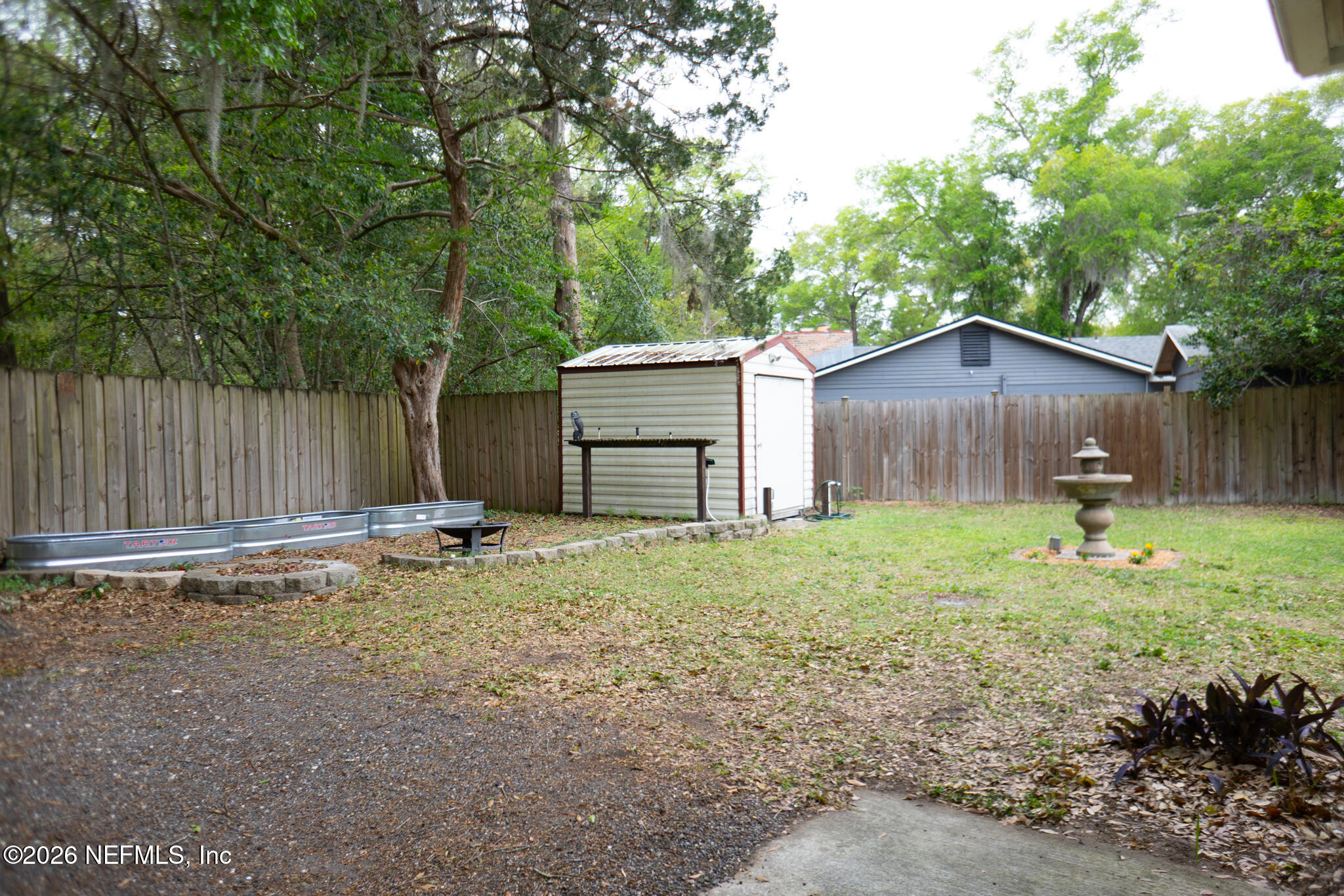 161 Southwest Jasmine Avenue Keystone Heights, FL 32656 - Photo 47 of 47 a backyard of a house with table and chairs