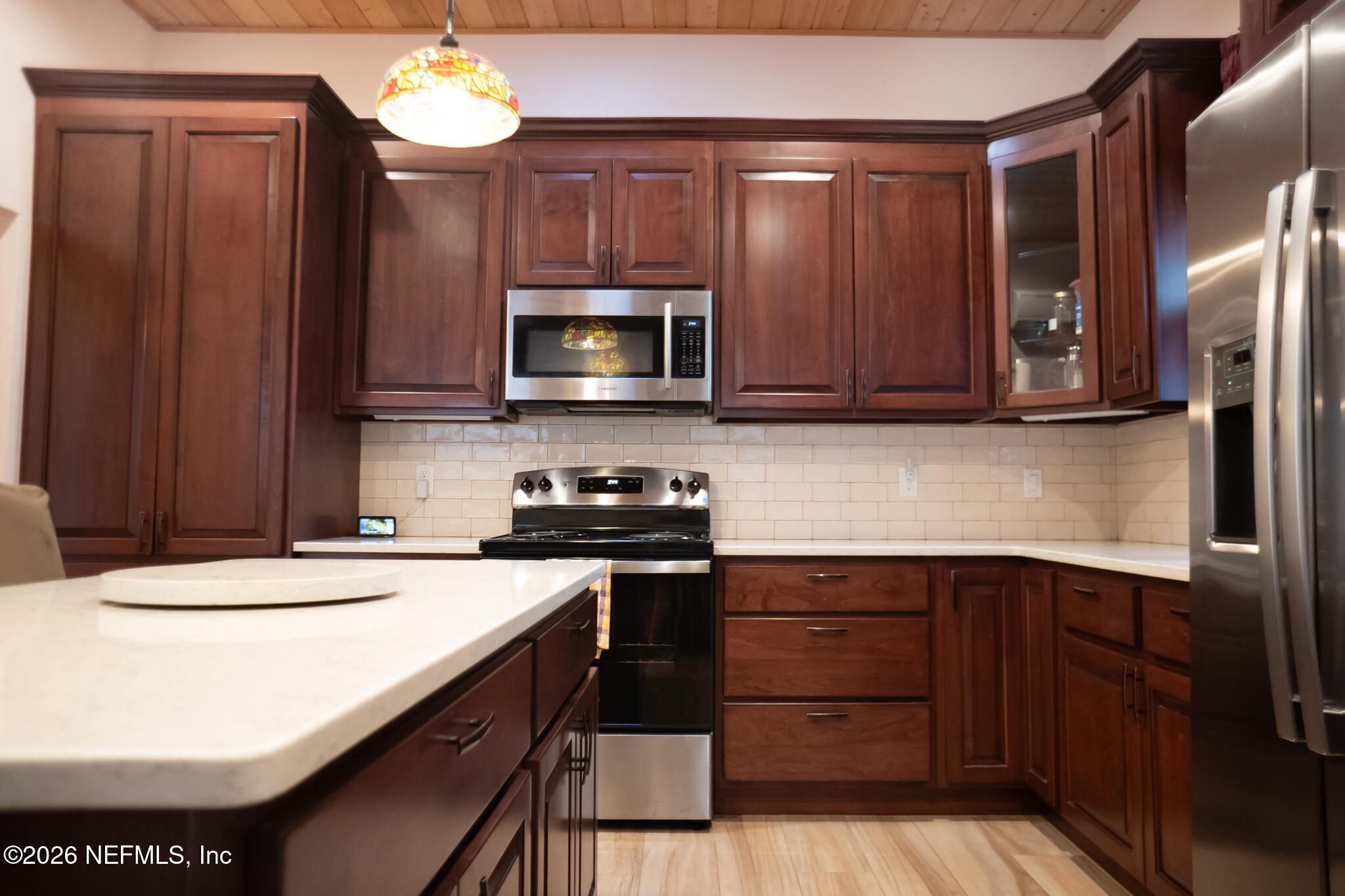 161 Southwest Jasmine Avenue Keystone Heights, FL 32656 - Photo 10 of 47 a kitchen with a appliances a sink and cabinets