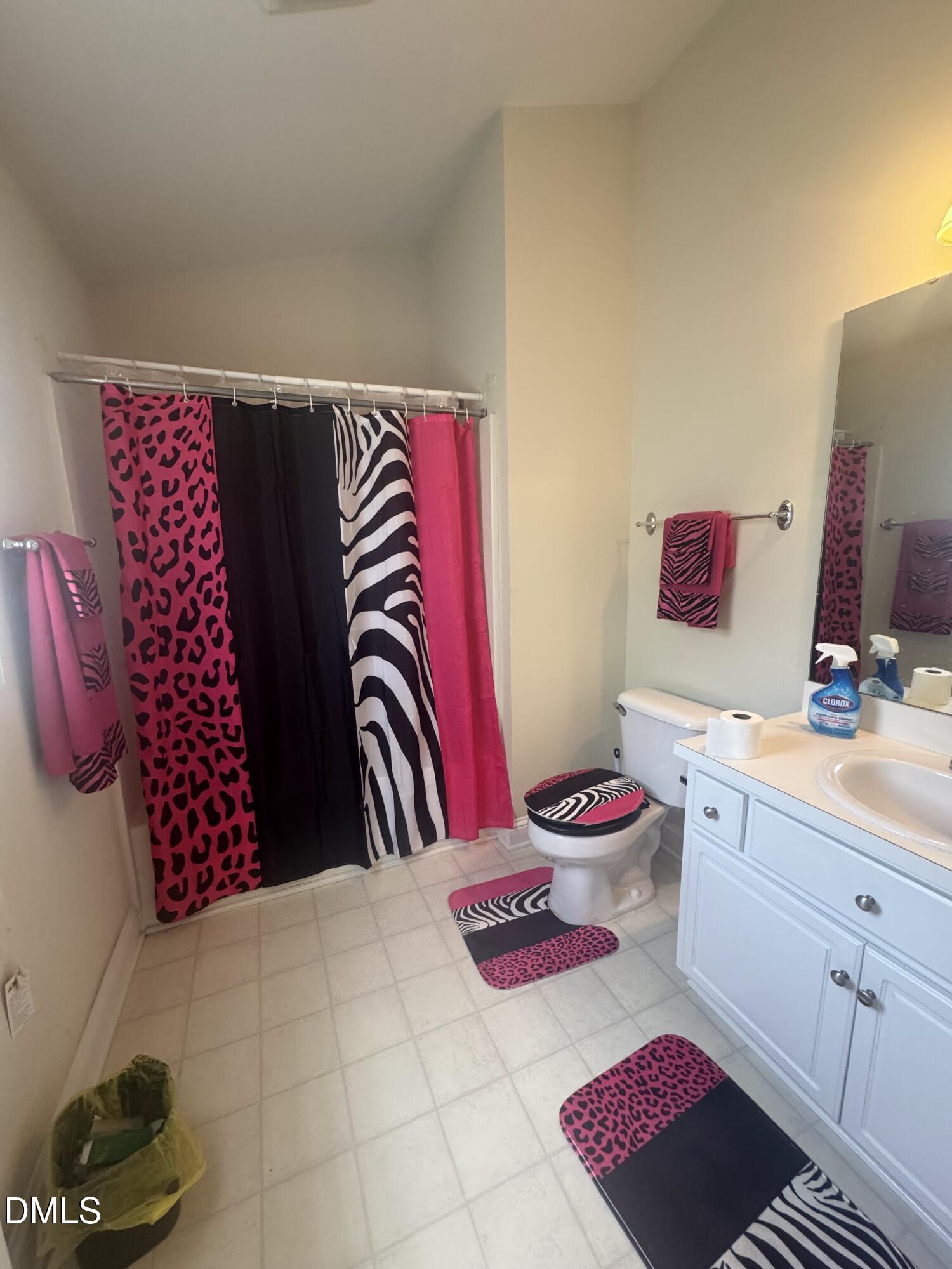 4109 Huntsmoor Lane Wilson, NC 27896 - Photo 13 of 26 a bathroom with a mirror and toilet