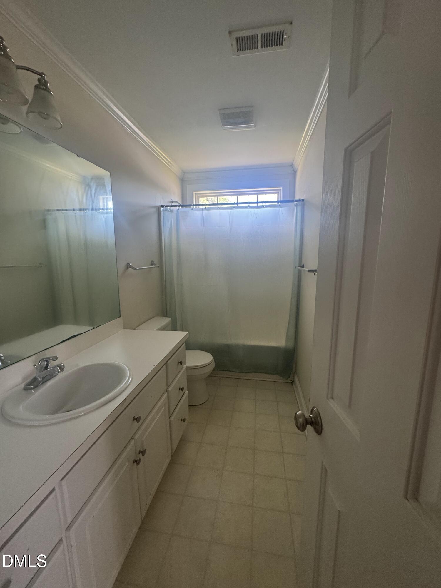 4109 Huntsmoor Lane Wilson, NC 27896 - Photo 19 of 26 a bathroom with a sink and mirror