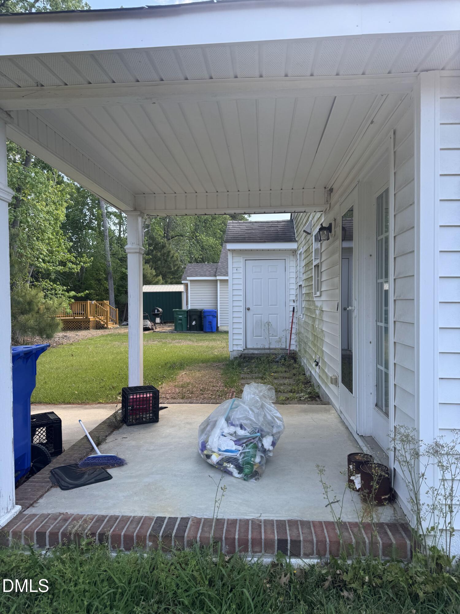 4109 Huntsmoor Lane Wilson, NC 27896 - Photo 24 of 26 a view of a chair and table in backyard