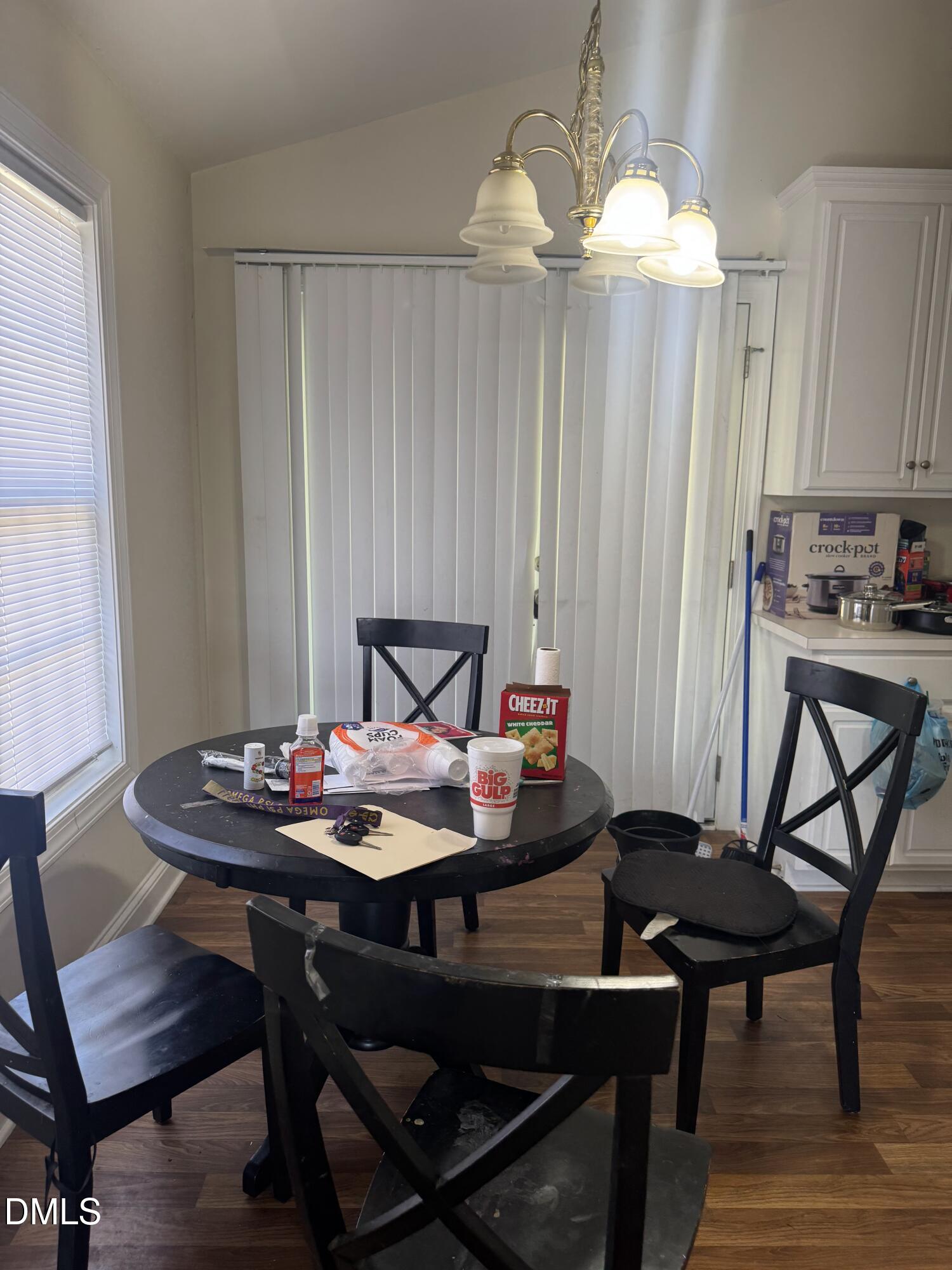 4109 Huntsmoor Lane Wilson, NC 27896 - Photo 6 of 26 a view of a dining room with furniture and chandelier