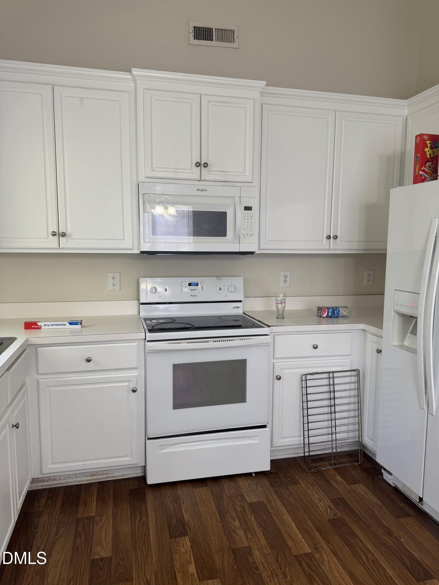 4109 Huntsmoor Lane Wilson, NC 27896 - Photo 8 of 26 a kitchen with granite countertop white cabinets and white appliances