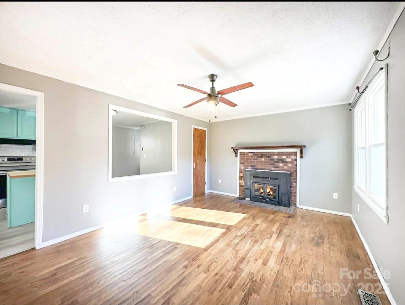 2238 Flatwood Road Lenoir, NC 28645 - Photo 3 of 12 a view of livingroom with a ceiling fan and window