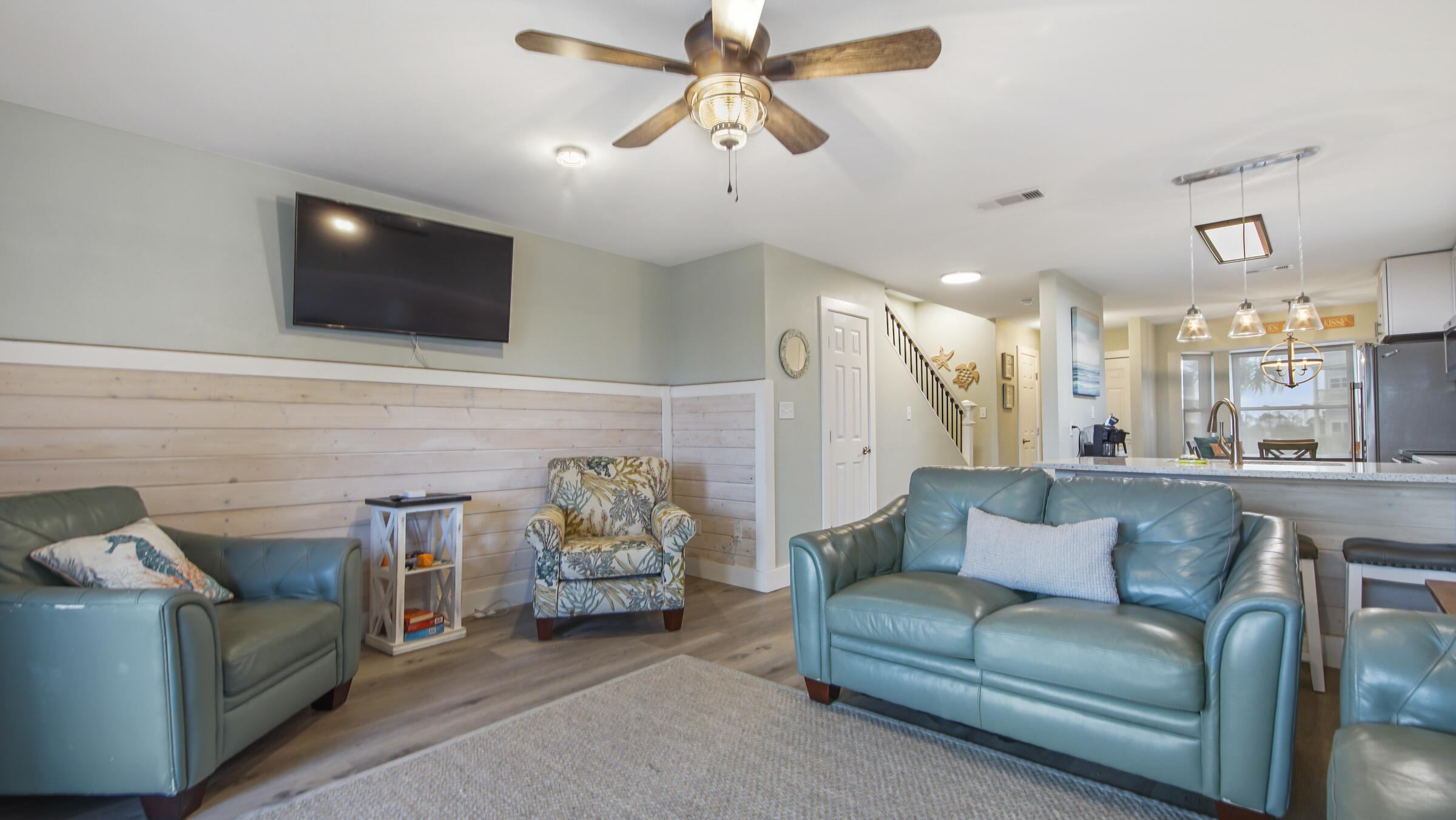 654 Seacliff Drive, Unit 4 Port St. Joe, FL 32456 - Photo 14 of 51 a living room with furniture and a flat screen tv