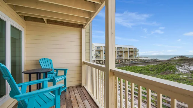 a view of a balcony with furniture