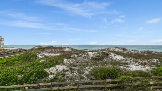 an aerial view of residential building and ocean