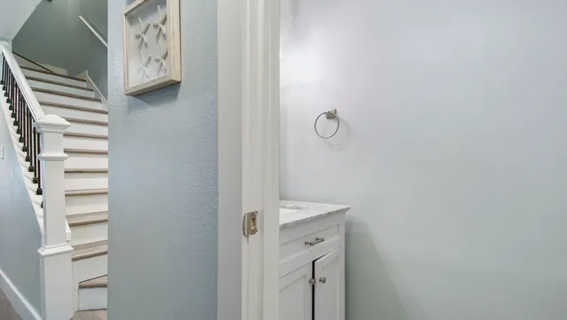 a bathroom with a shower and a sink