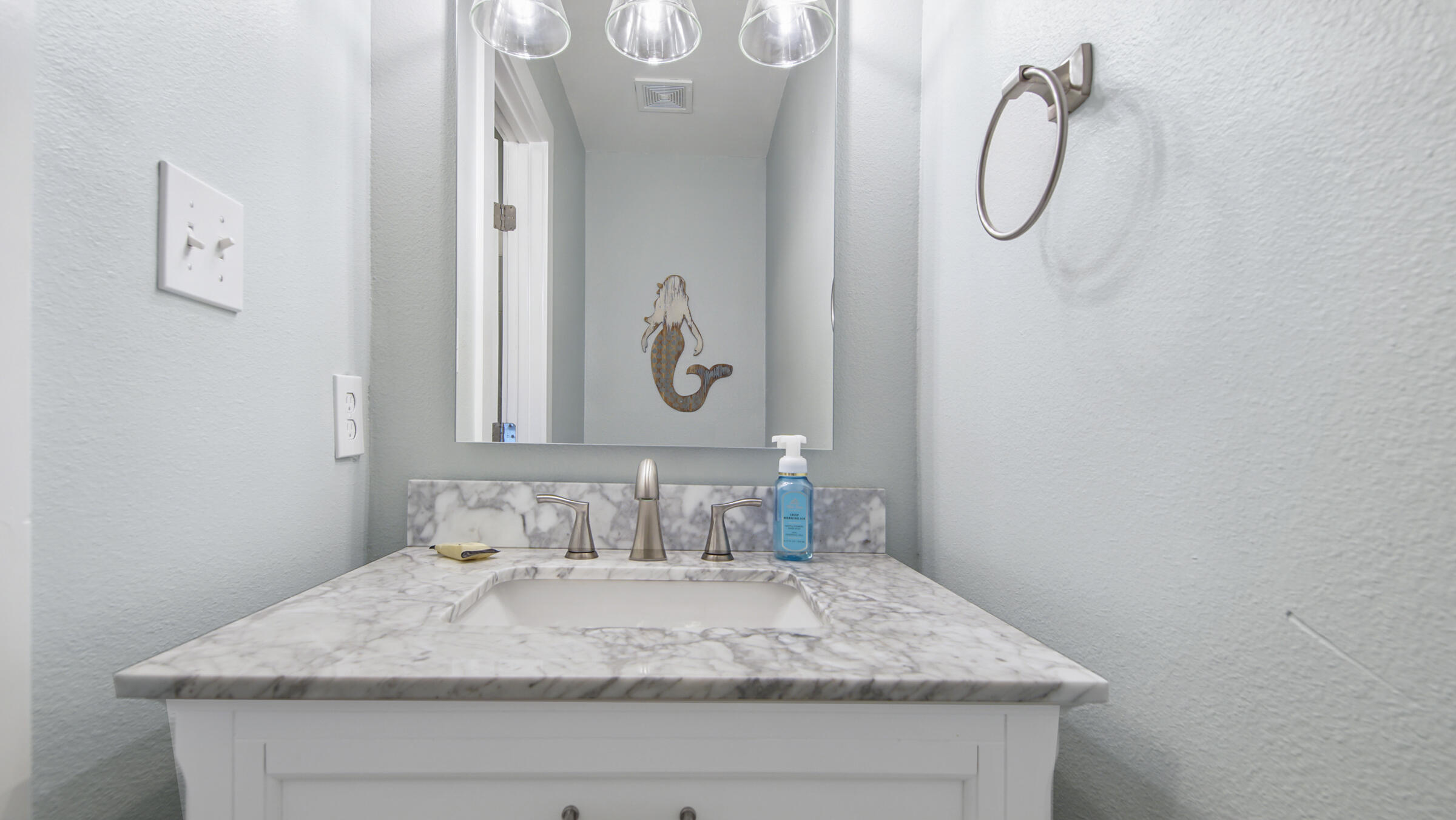 654 Seacliff Drive, Unit 4 Port St. Joe, FL 32456 - Photo 24 of 51 a bathroom with a granite countertop sink and a mirror