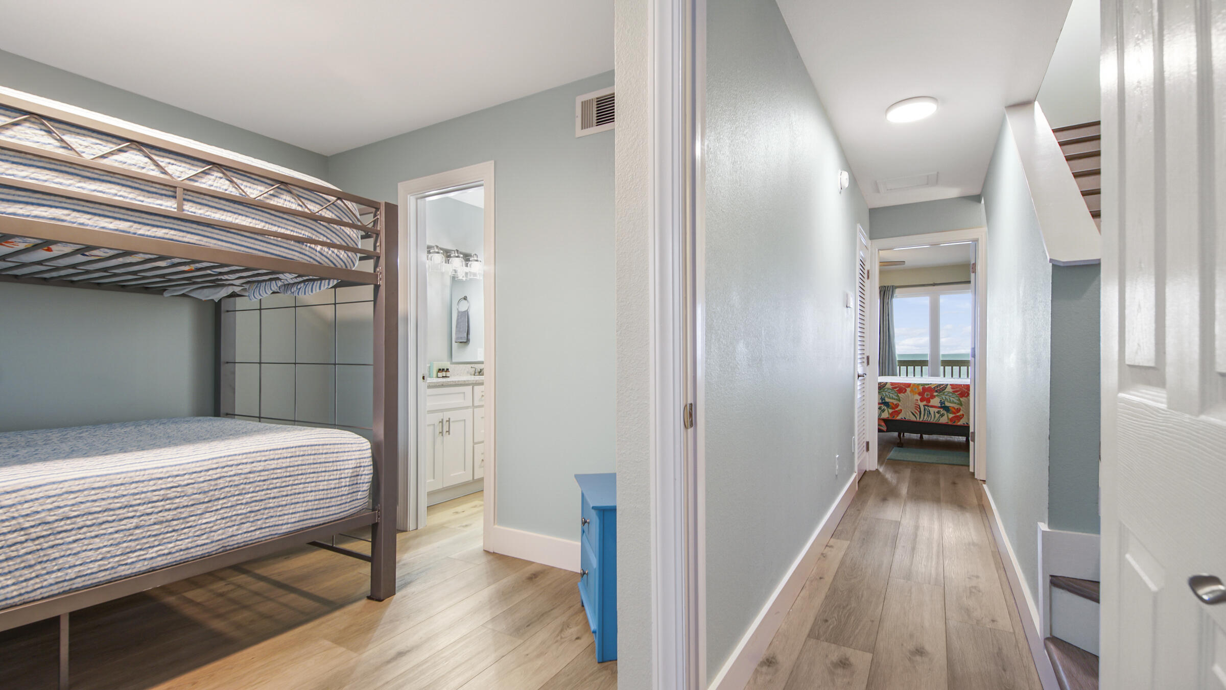 654 Seacliff Drive, Unit 4 Port St. Joe, FL 32456 - Photo 27 of 51 a bedroom with a bed and wooden floor