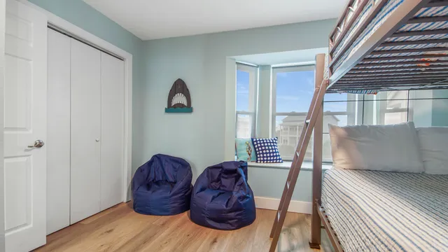 a view of entryway livingroom and hall with wooden floor