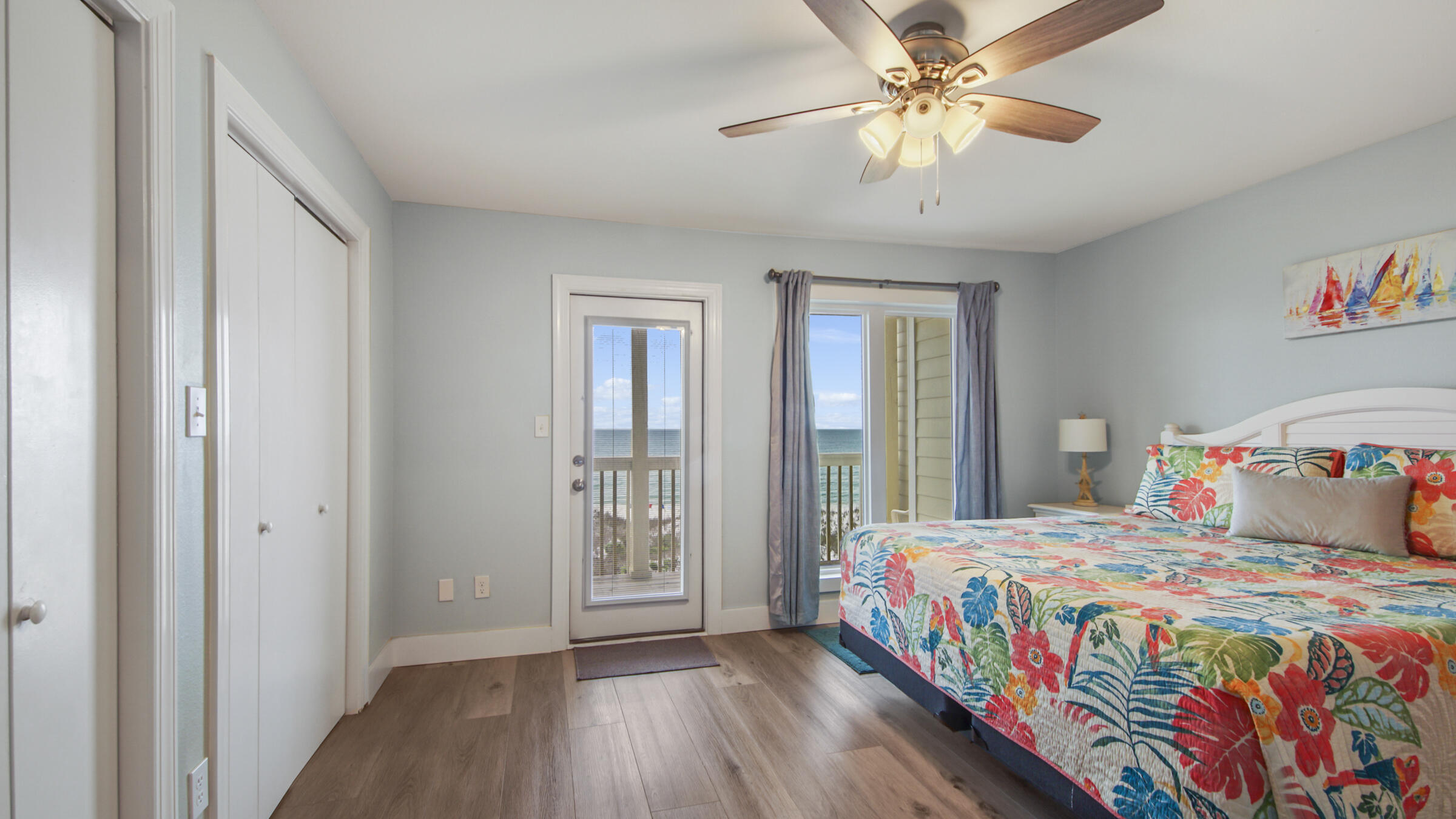 654 Seacliff Drive, Unit 4 Port St. Joe, FL 32456 - Photo 33 of 51 a bedroom with a bed and a chandelier