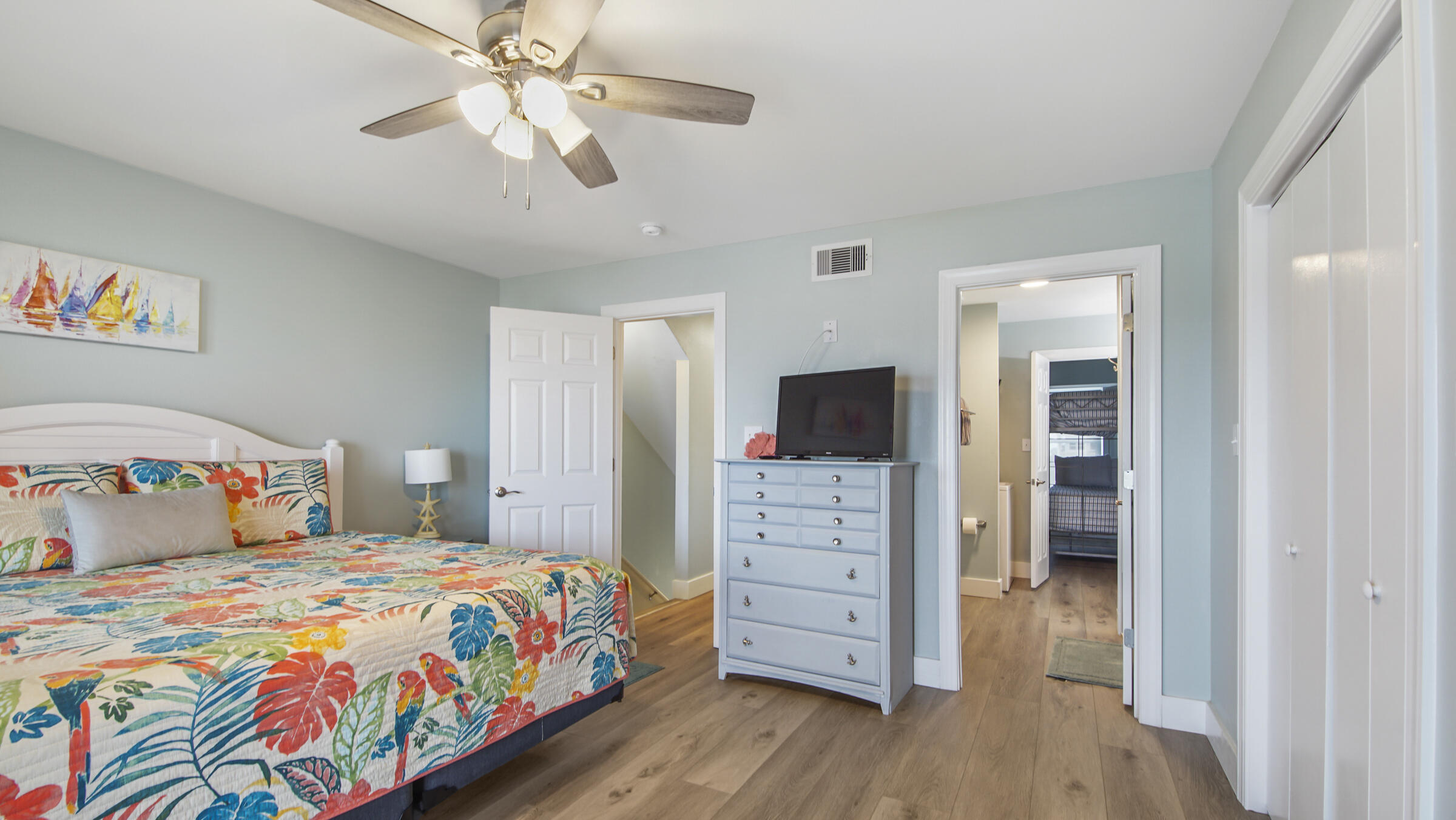 654 Seacliff Drive, Unit 4 Port St. Joe, FL 32456 - Photo 34 of 51 a bedroom with a bed and a tv