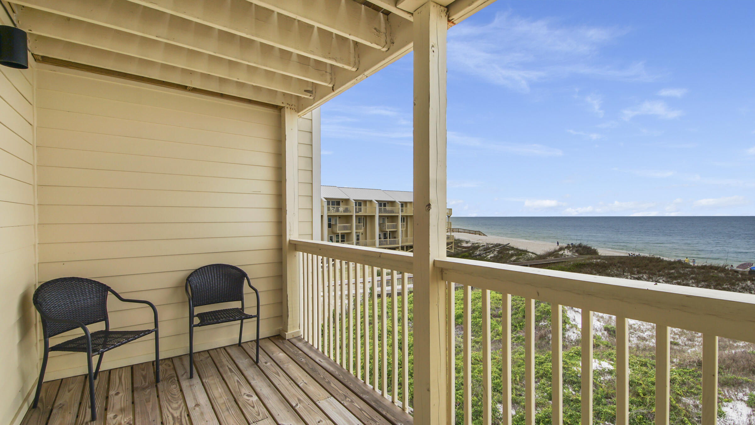 654 Seacliff Drive, Unit 4 Port St. Joe, FL 32456 - Photo 40 of 51 a view of a balcony with chair and table