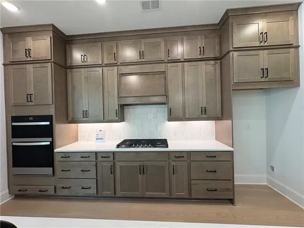 a bathroom with a sink toilet vanity and bathtub