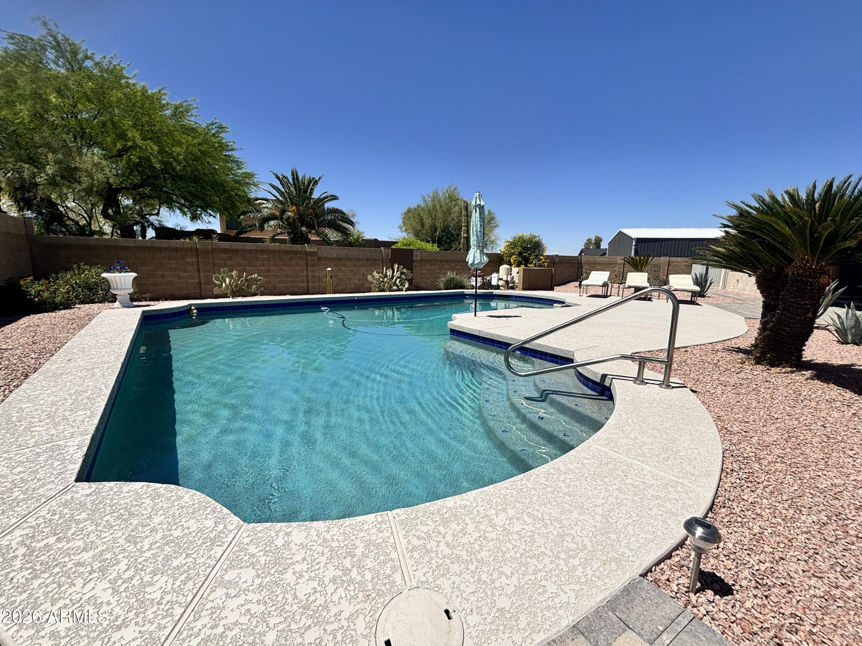 7745 East Mangun Road Mesa, AZ 85207 - Photo 12 of 35 a view of a swimming pool with an outdoor seating