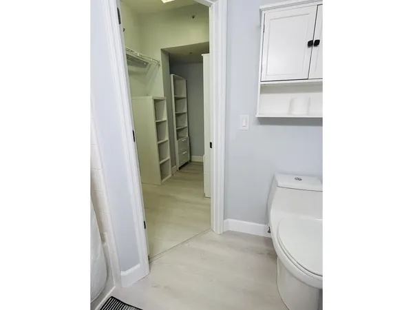 a view of a bathroom from a hallway