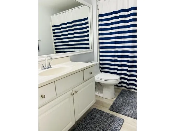 a bathroom with a sink and a toilet