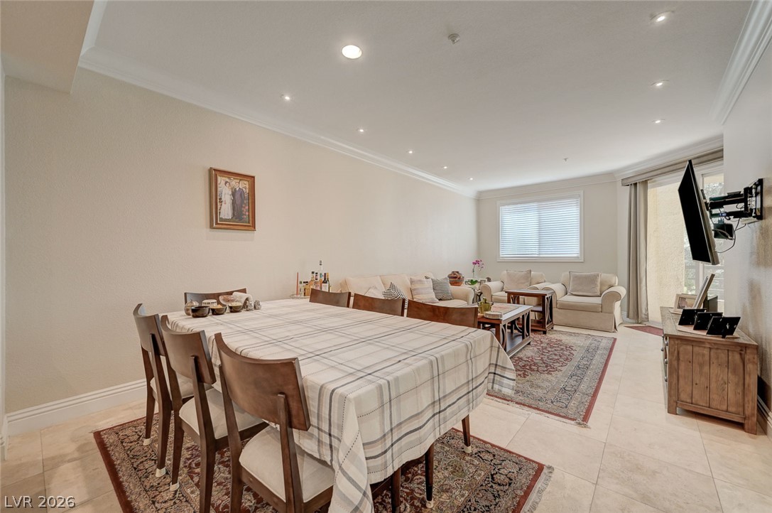 230 East Flamingo Road, Unit 106 Las Vegas, NV 89169 - Photo 4 of 66 Recessed lighting illuminates this versatile great room, ideal for both dining and casual living.