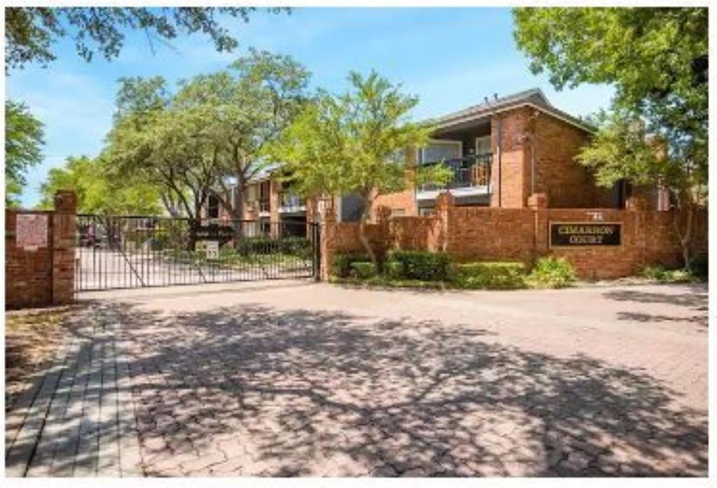 18333 Roehampton Drive, Unit 1212 Dallas, TX 75252 - Photo 1 of 1 a front view of a house with a yard and garage