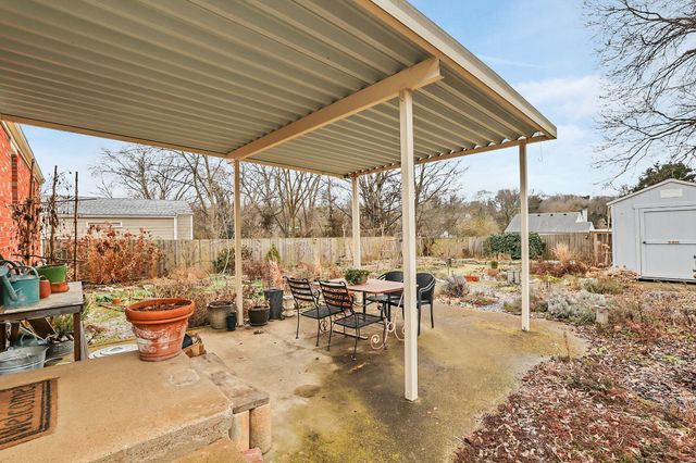 a view of a flower in a yard