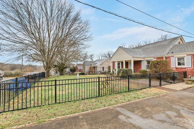 a view of a house with a street