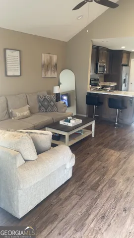 a kitchen with a sink a stove a refrigerator and cabinets