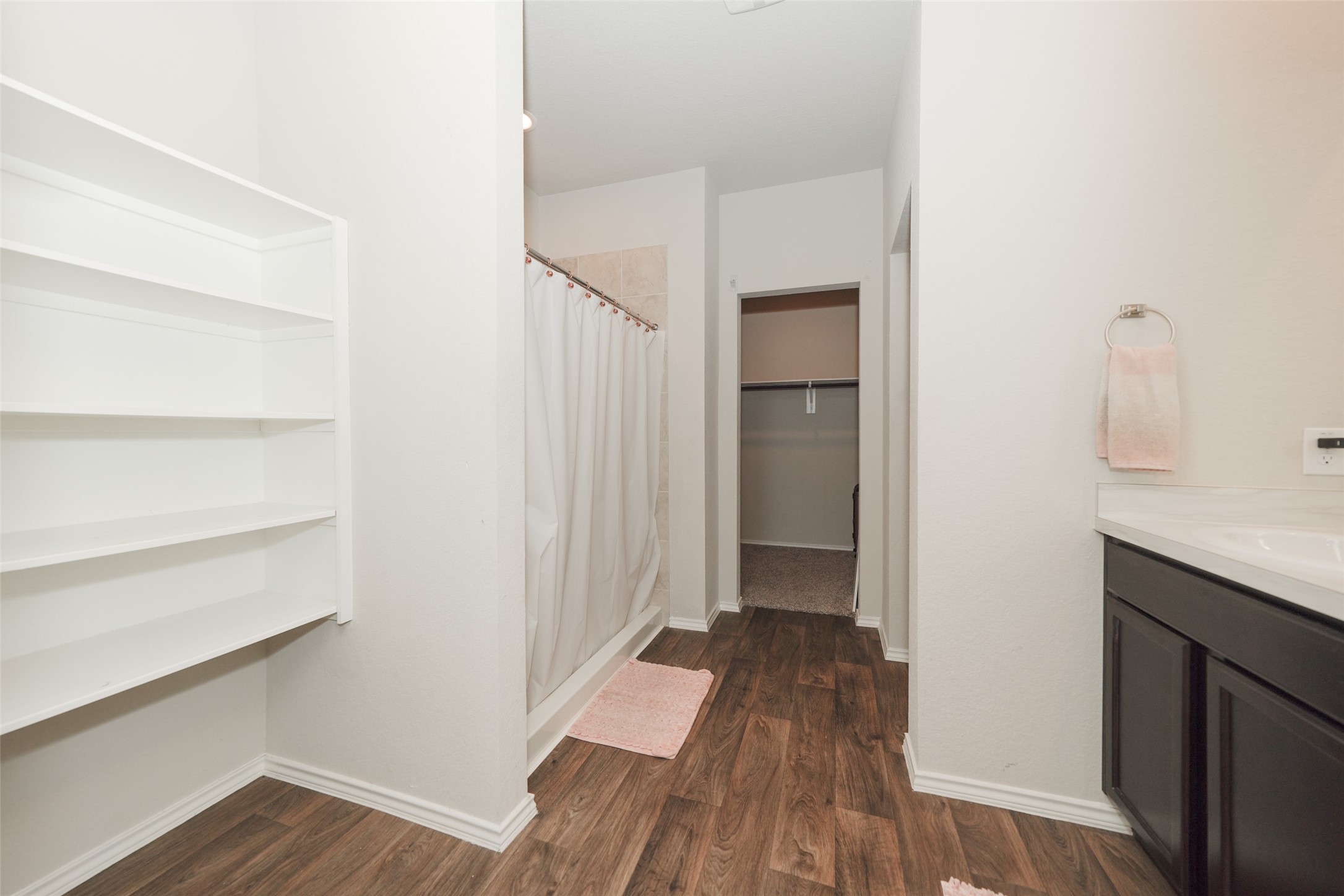 20818 Edmeston Way Katy, TX 77449 - Photo 24 of 32 a view of a hallway with wooden floor and closet