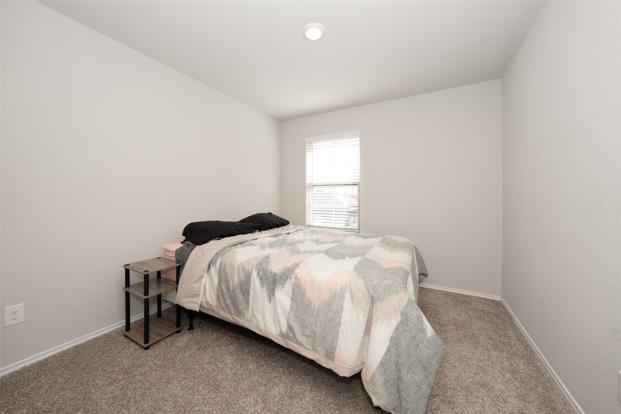 20818 Edmeston Way Katy, TX 77449 - Photo 29 of 32 a bedroom with a bed and window