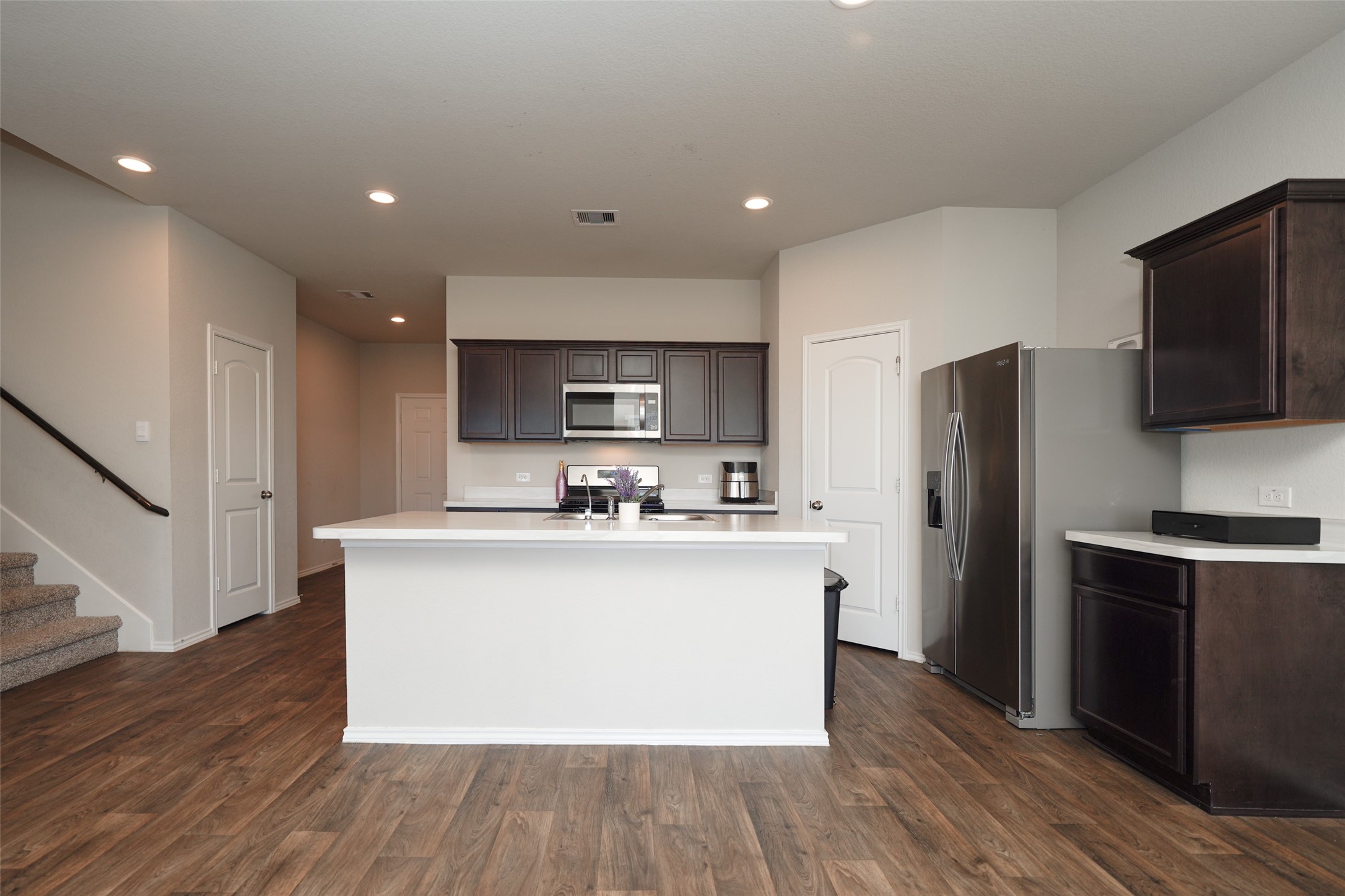 20818 Edmeston Way Katy, TX 77449 - Photo 9 of 32 a kitchen with stainless steel appliances a sink stove and refrigerator