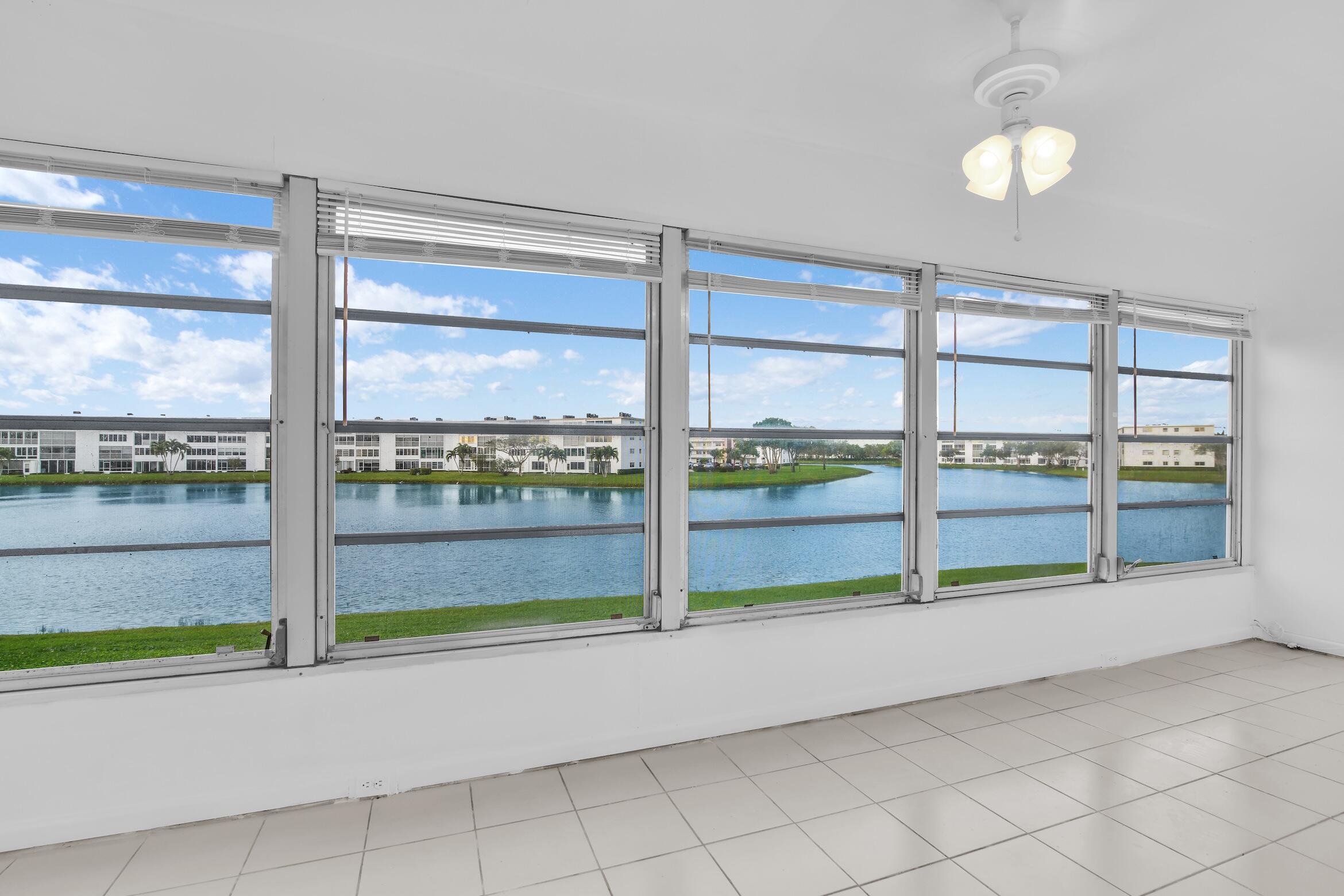 2043 Cornwall C, Unit 2043 Boca Raton, FL 33434 - Photo 12 of 22 a view of an empty room and window