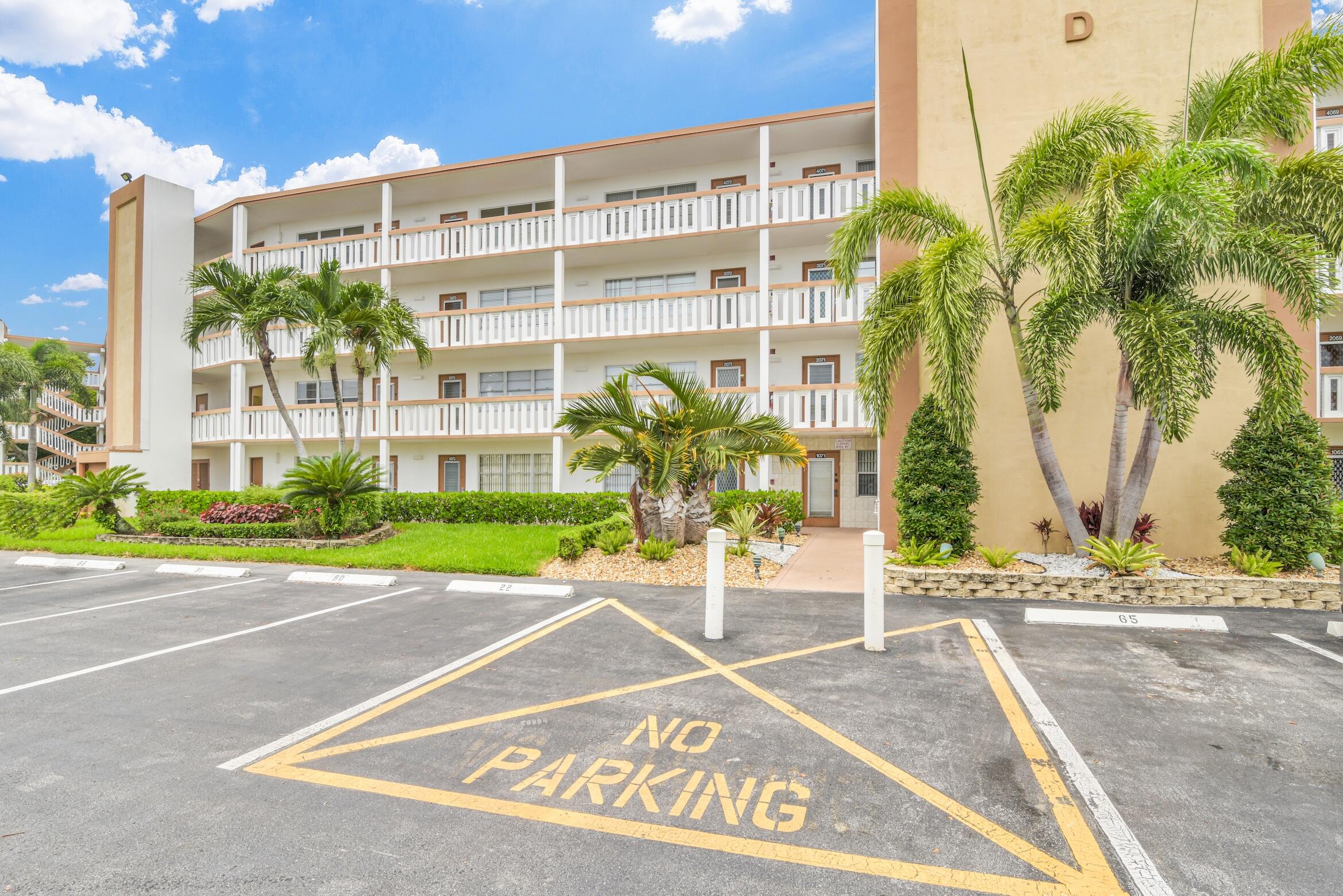 2043 Cornwall C, Unit 2043 Boca Raton, FL 33434 - Photo 22 of 22 a view of a building with a street