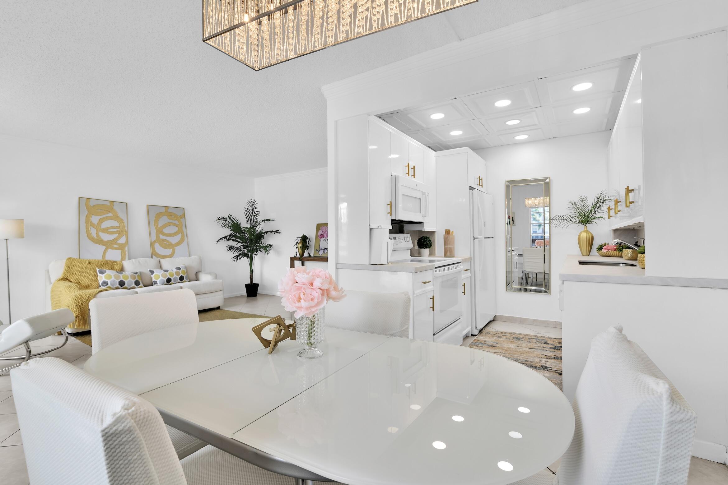 2043 Cornwall C, Unit 2043 Boca Raton, FL 33434 - Photo 4 of 22 a large white kitchen with stainless steel appliances