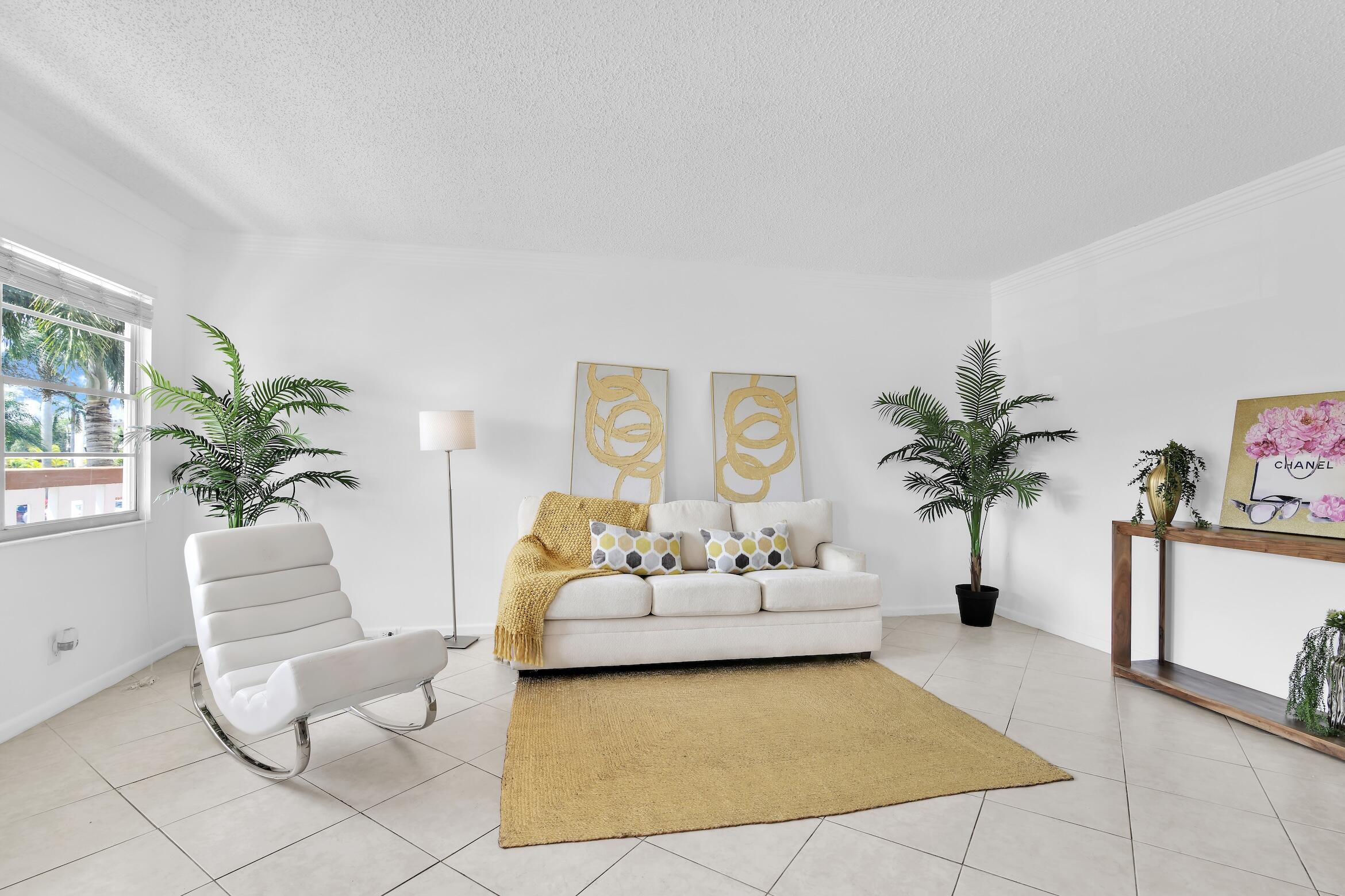 2043 Cornwall C, Unit 2043 Boca Raton, FL 33434 - Photo 7 of 22 a living room with furniture and a potted plant