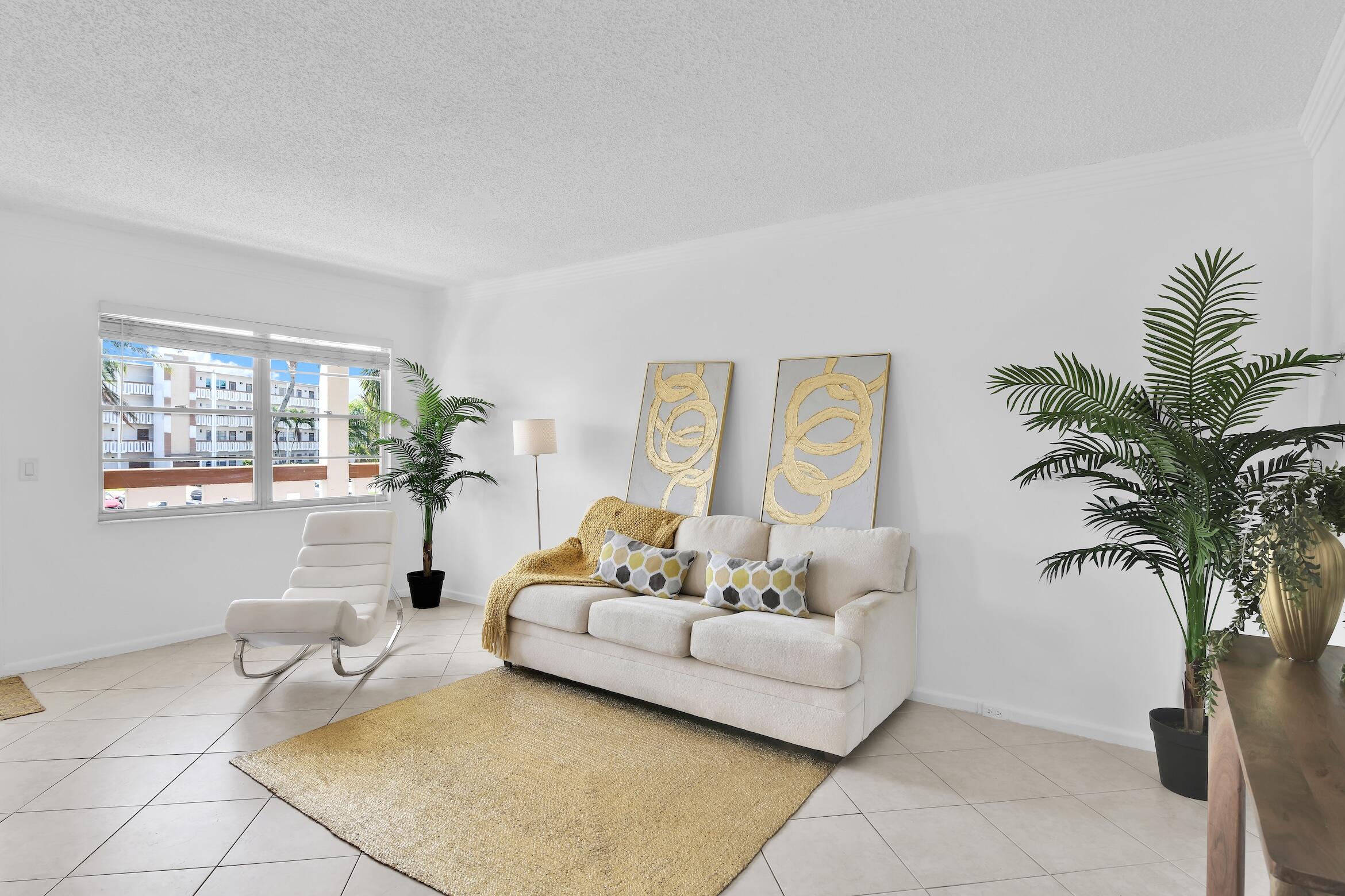2043 Cornwall C, Unit 2043 Boca Raton, FL 33434 - Photo 8 of 22 a living room with furniture and a potted plant