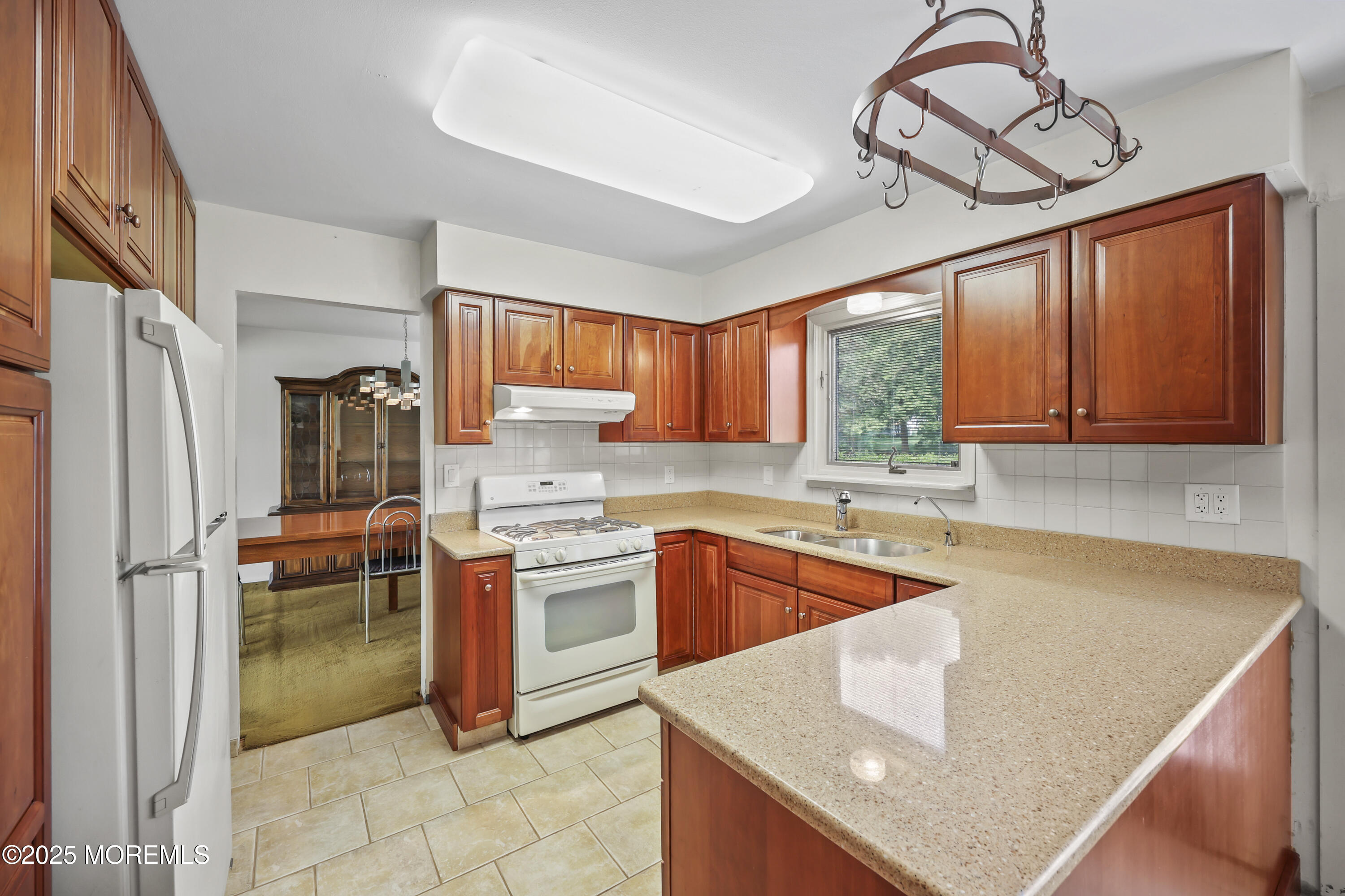 27 Sargent Road Freehold, NJ 07728 - Photo 11 of 47 a kitchen with stainless steel appliances granite countertop a sink dishwasher stove and refrigerator