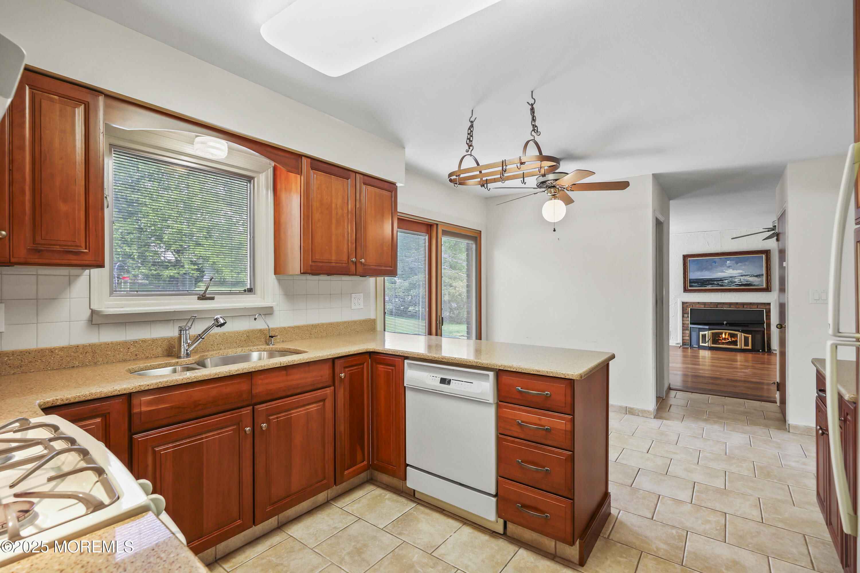 27 Sargent Road Freehold, NJ 07728 - Photo 12 of 47 a kitchen with a sink and cabinets