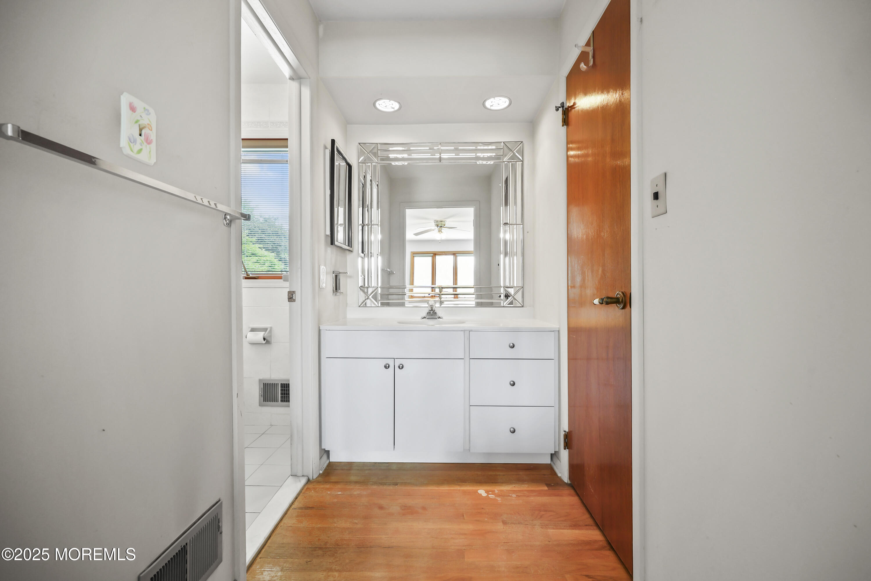 27 Sargent Road Freehold, NJ 07728 - Photo 22 of 47 a bathroom with a sink and a mirror
