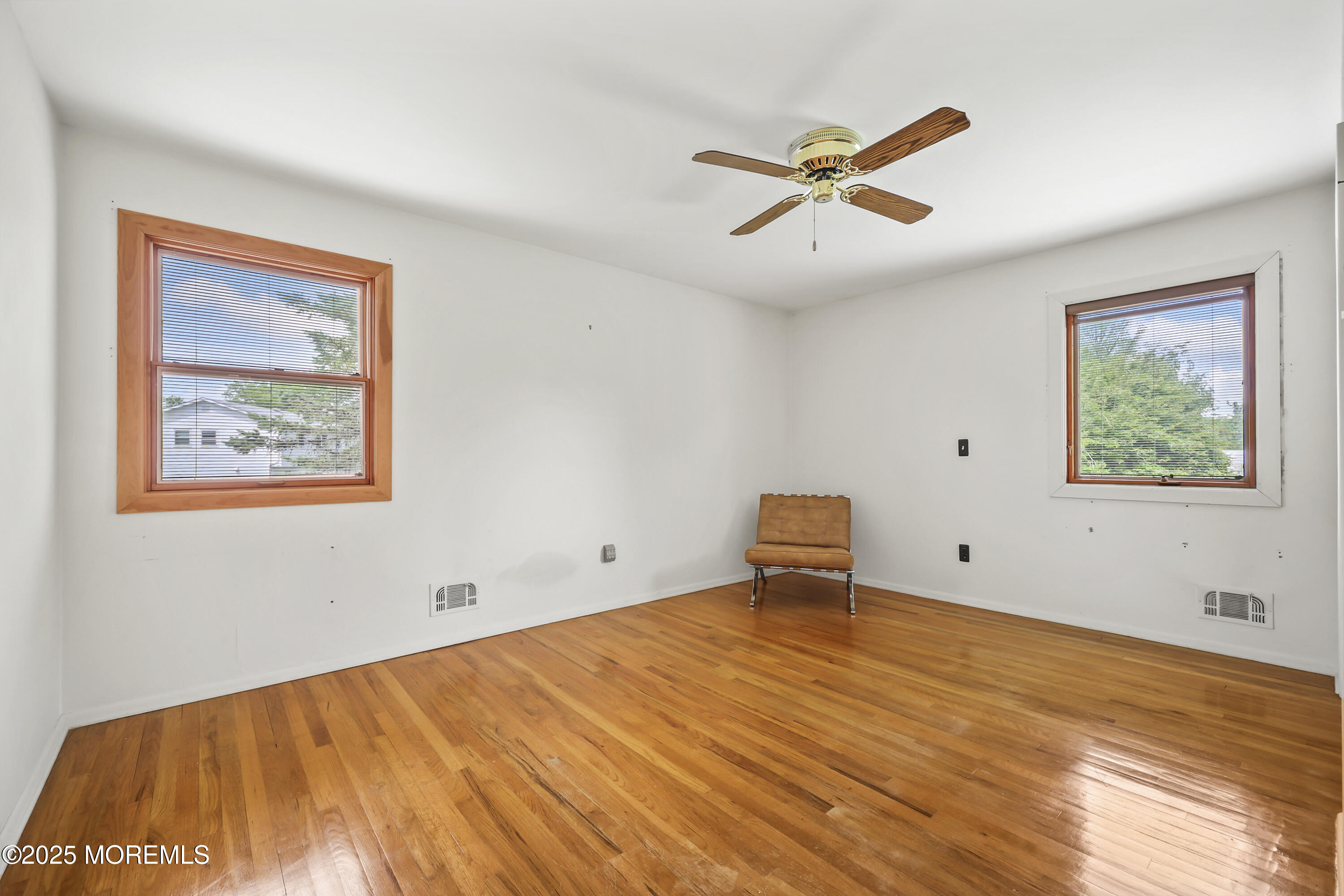 27 Sargent Road Freehold, NJ 07728 - Photo 27 of 47 a view of a big room with wooden floor and windows