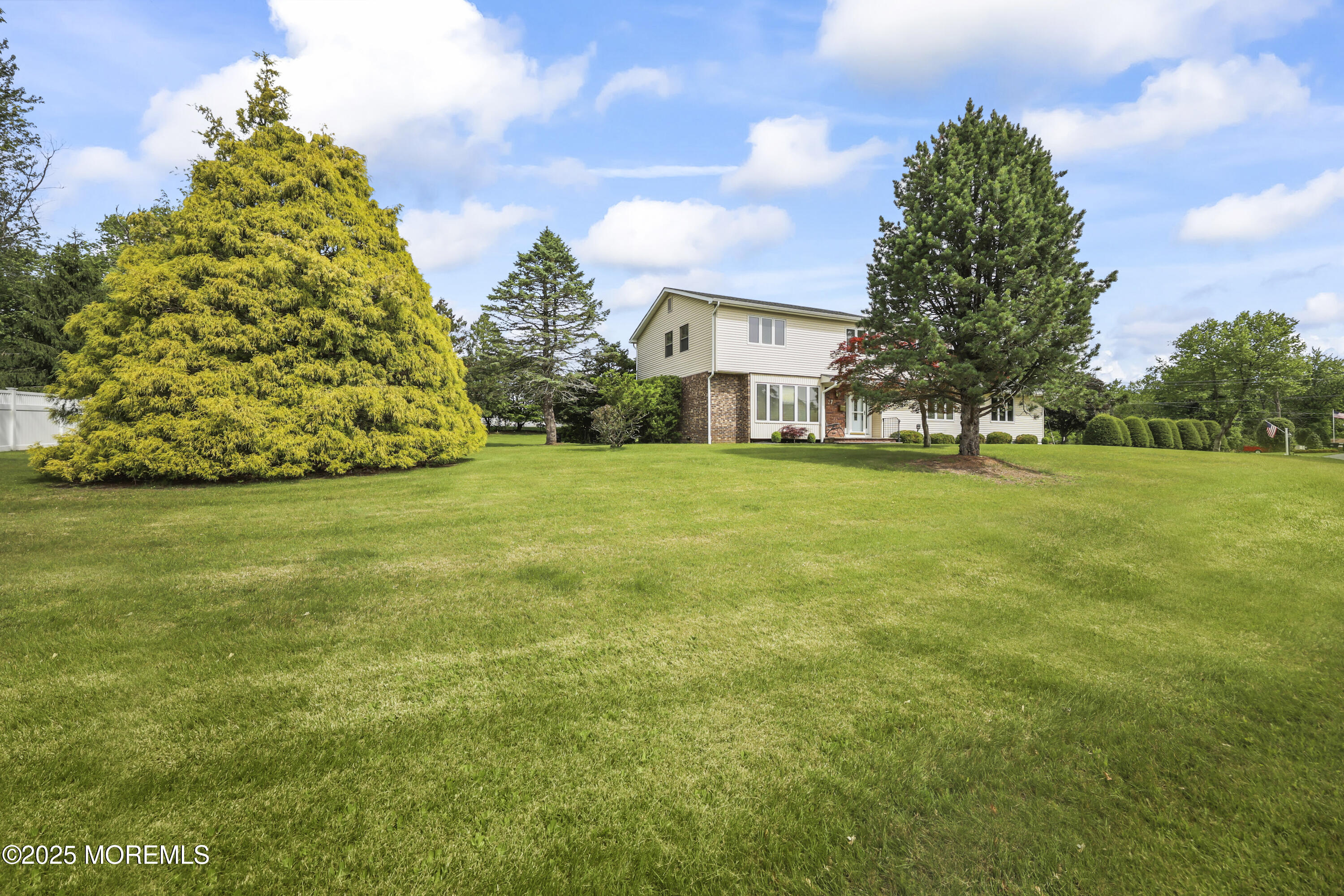 27 Sargent Road Freehold, NJ 07728 - Photo 3 of 47 a view of a big yard with a house