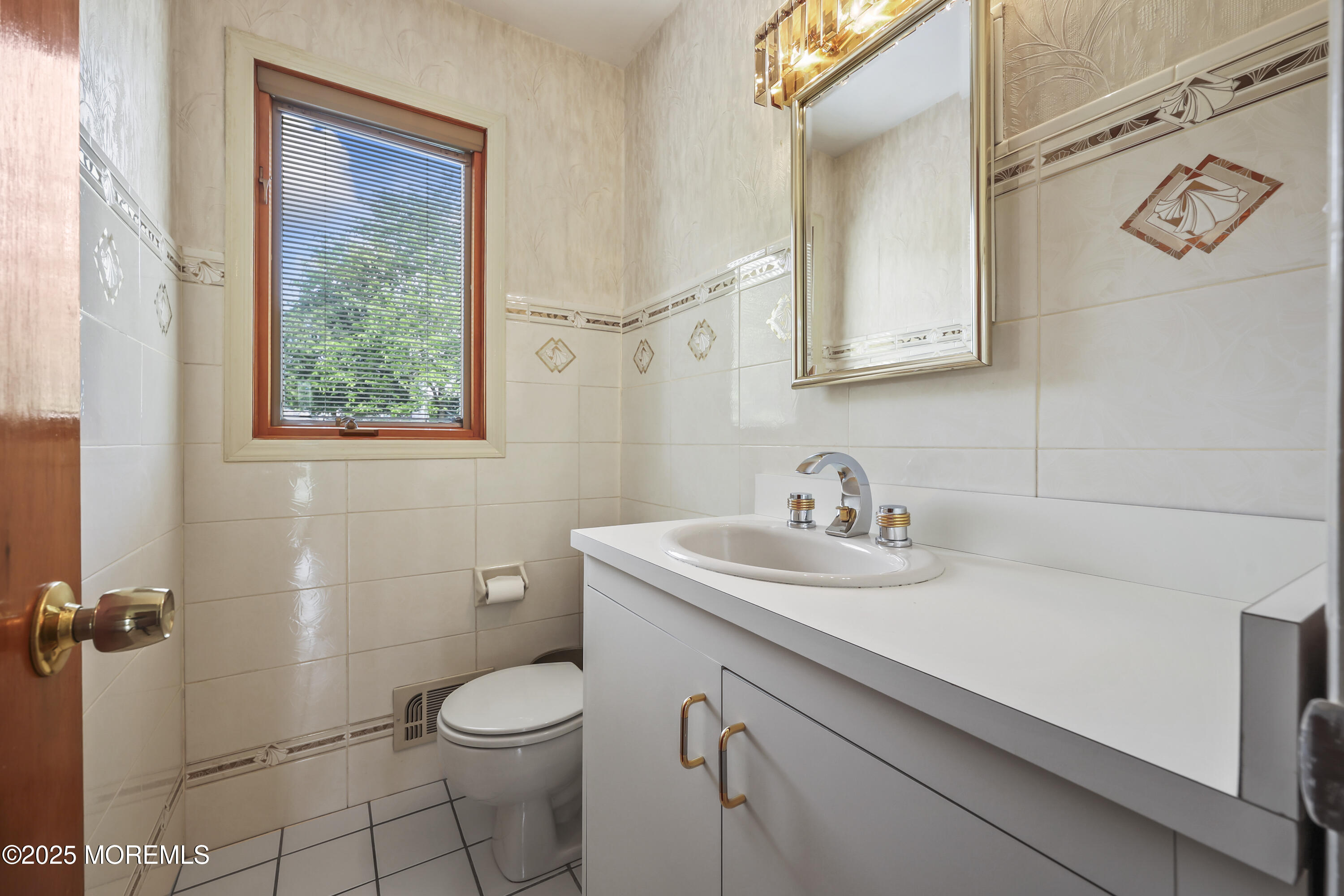 27 Sargent Road Freehold, NJ 07728 - Photo 32 of 47 a bathroom with a granite countertop toilet sink and mirror