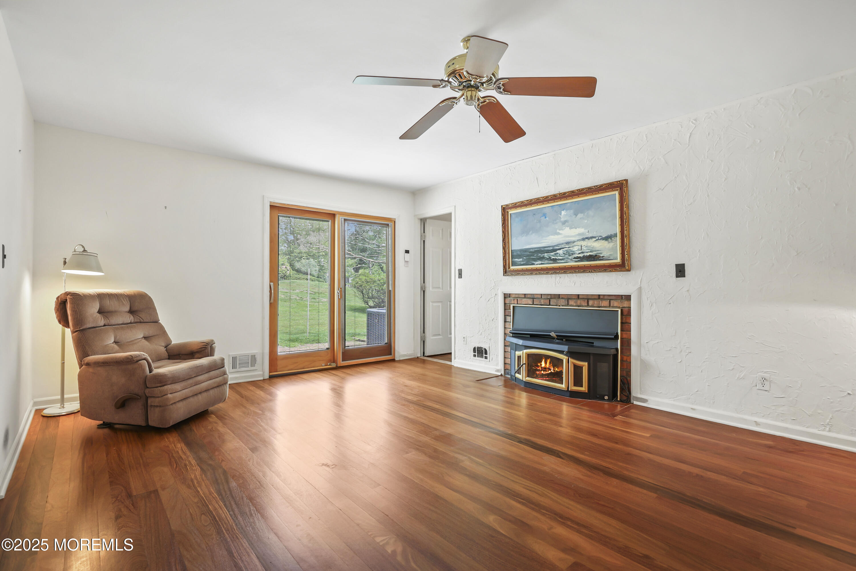 27 Sargent Road Freehold, NJ 07728 - Photo 34 of 47 a living room with furniture and a fireplace