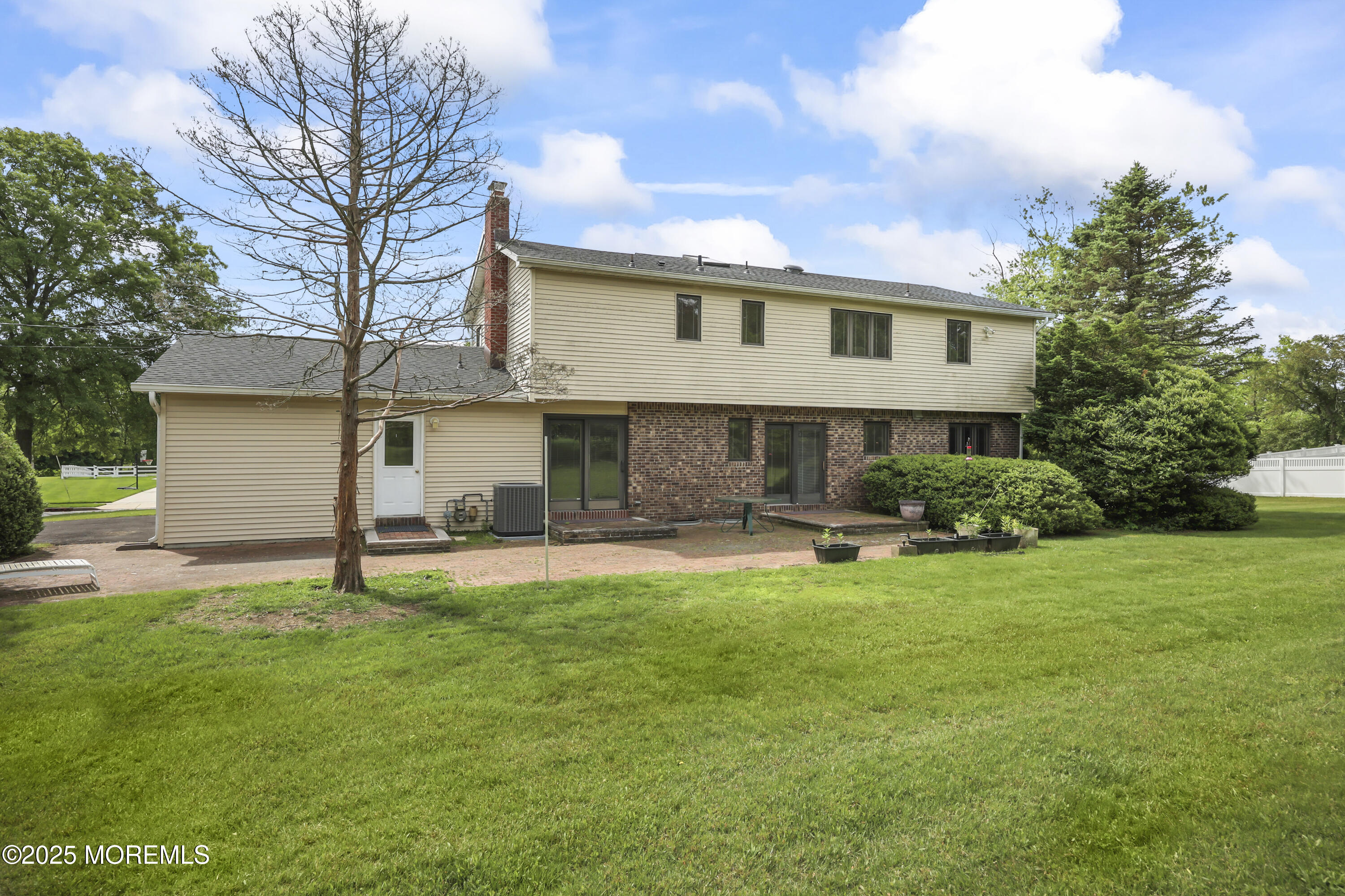 27 Sargent Road Freehold, NJ 07728 - Photo 39 of 47 a front view of a house with a yard and garage